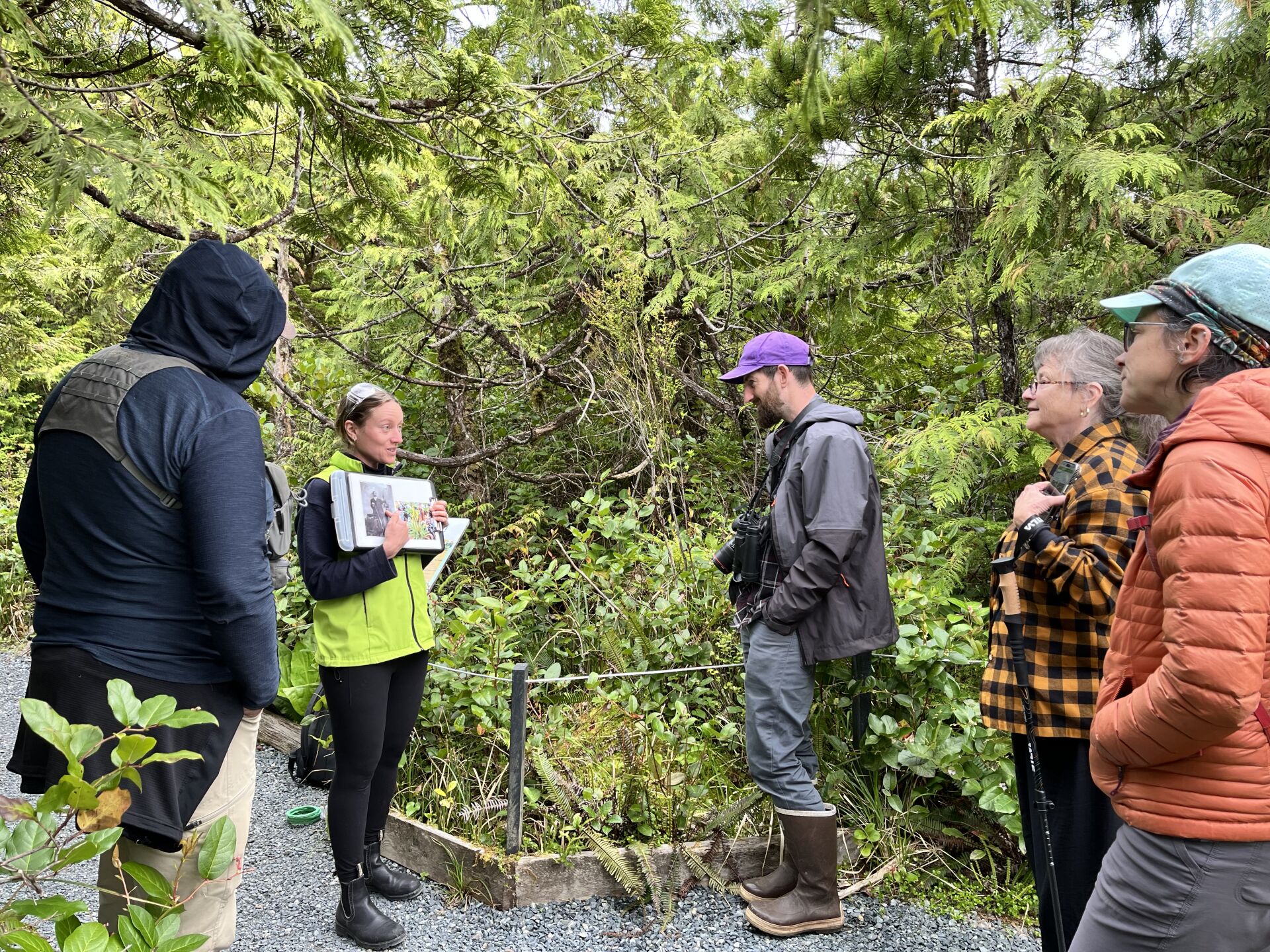 Photo of naturalist Tanya, leading a group walk in the bog on the Wild Pacific Trail, Ucluelet.